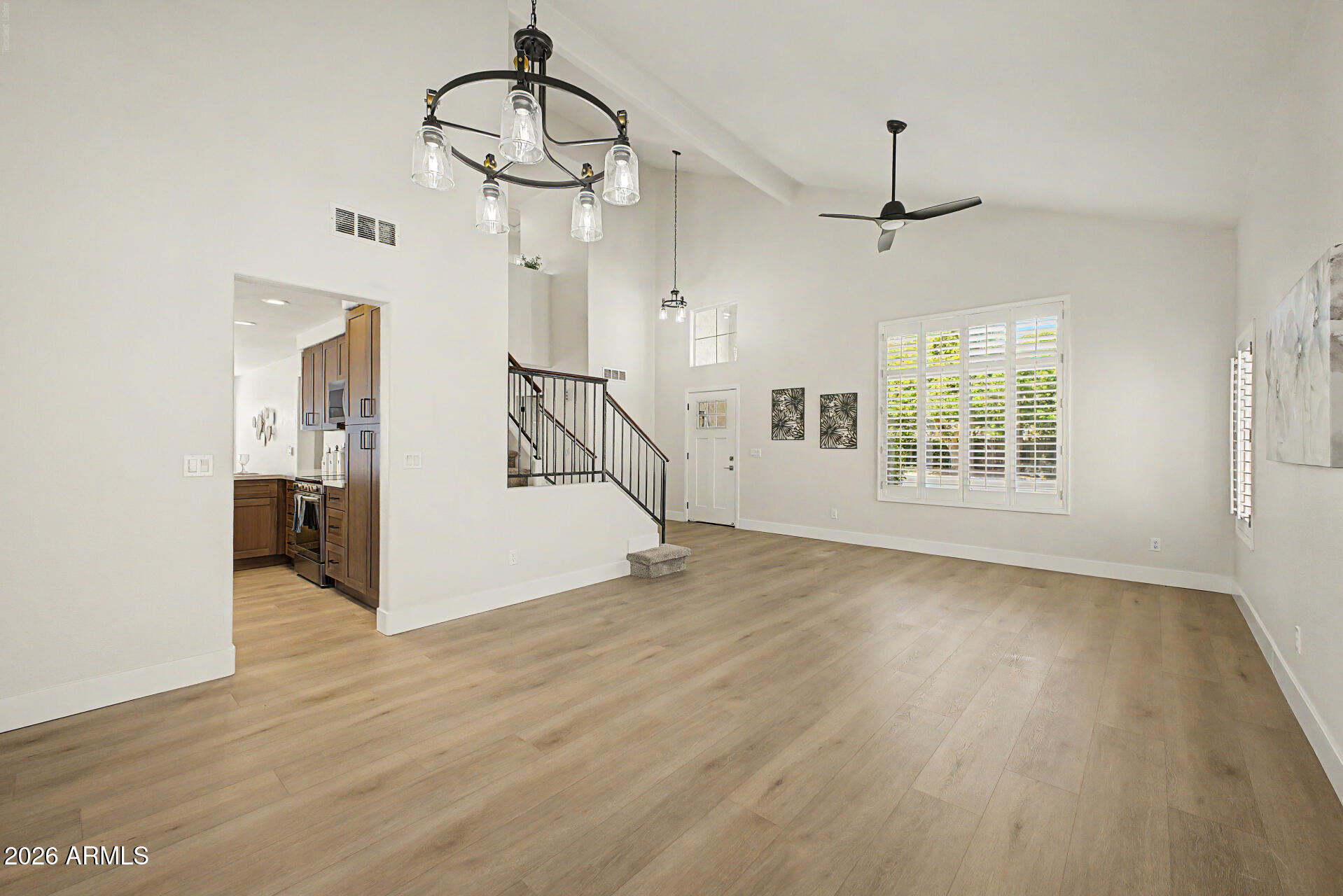 1743 East Redfield Road Gilbert, AZ 85234 - Photo 6 of 30 a view of empty room with wooden floor and windows