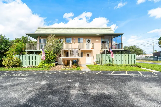 a view of house with outdoor space and porch