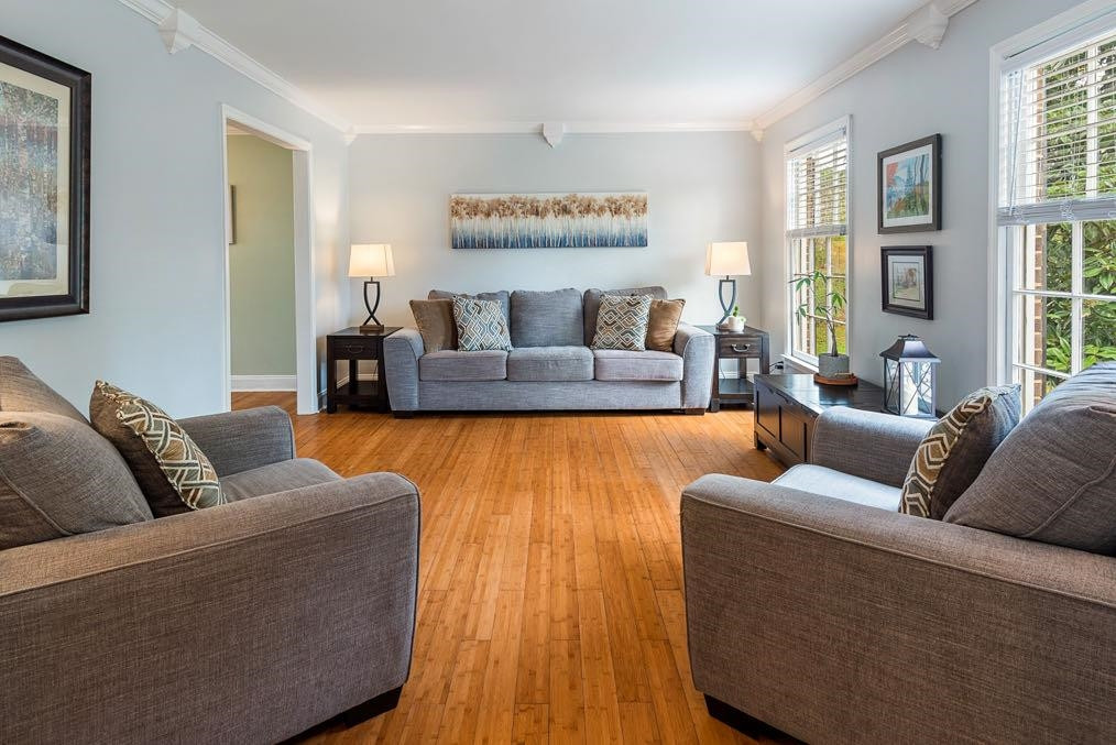 5614 Pelham Road Durham, NC 27713 - Photo 11 of 37 a living room with furniture and a large window
