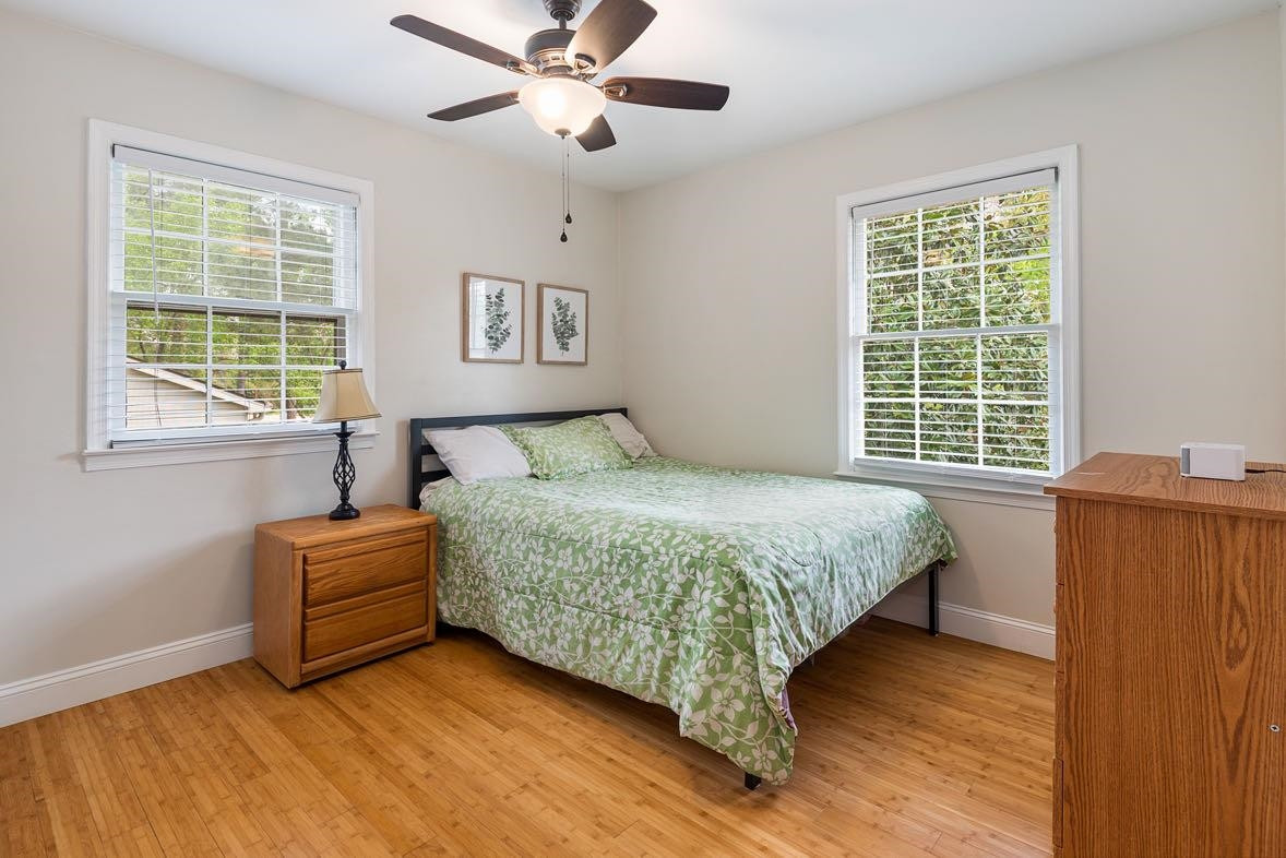 5614 Pelham Road Durham, NC 27713 - Photo 17 of 37 a bedroom with a bed and a large window