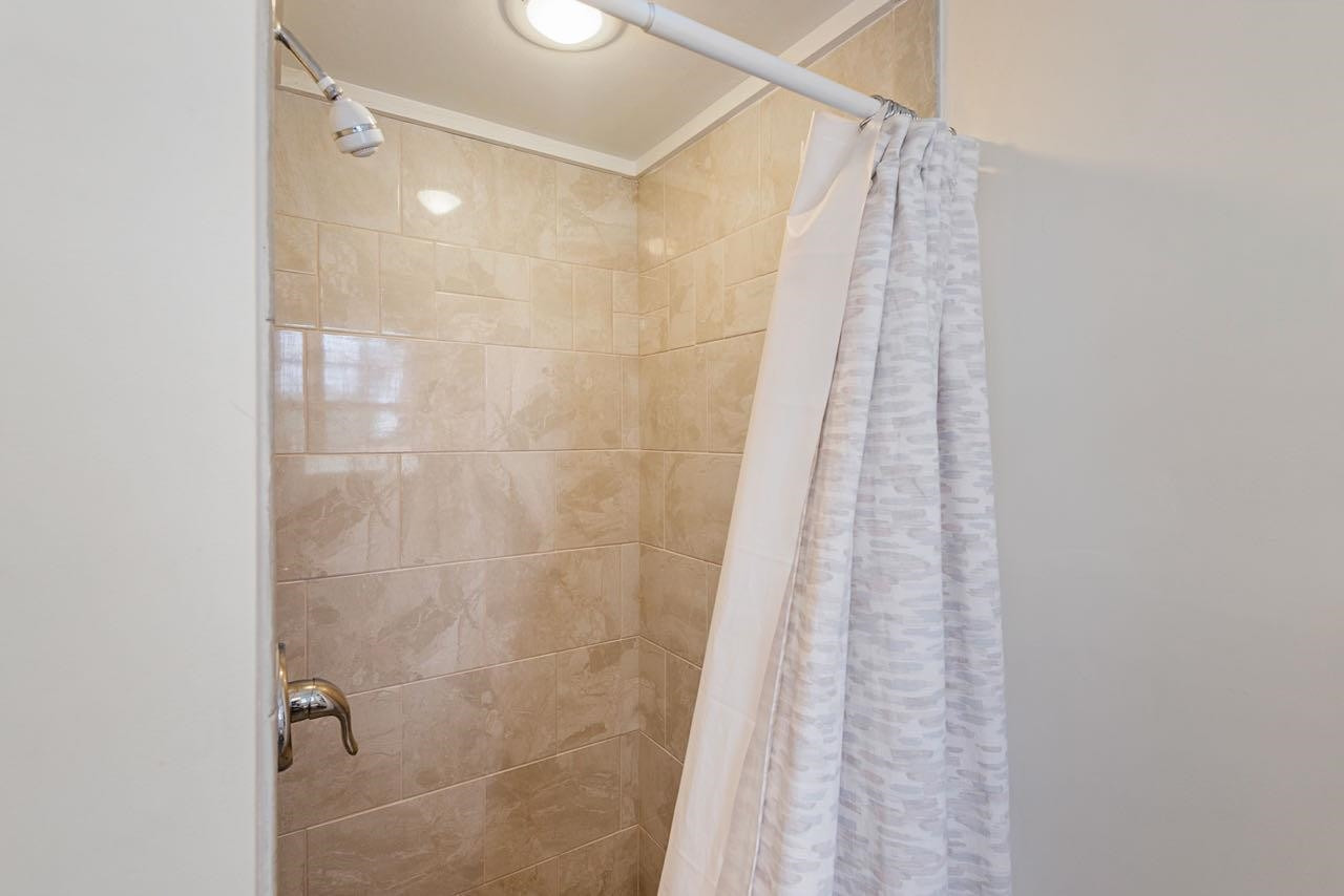 5614 Pelham Road Durham, NC 27713 - Photo 23 of 37 a bathroom with a shower