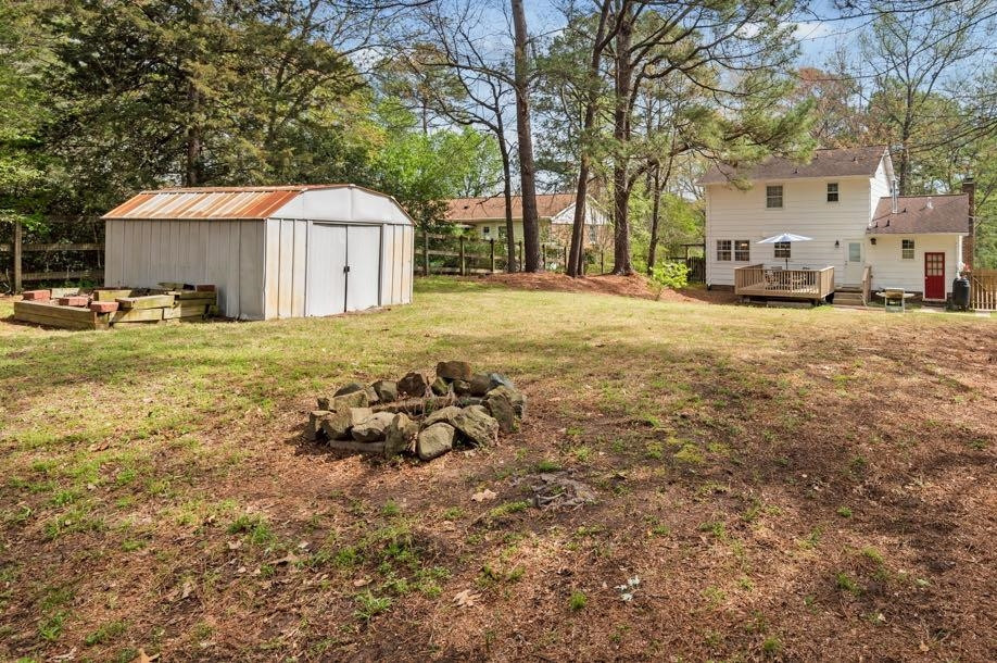 5614 Pelham Road Durham, NC 27713 - Photo 29 of 37 a view of a house with a yard