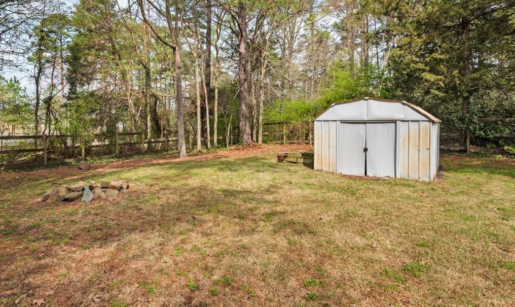 5614 Pelham Road Durham, NC 27713 - Photo 32 of 37 a view of a backyard with large trees