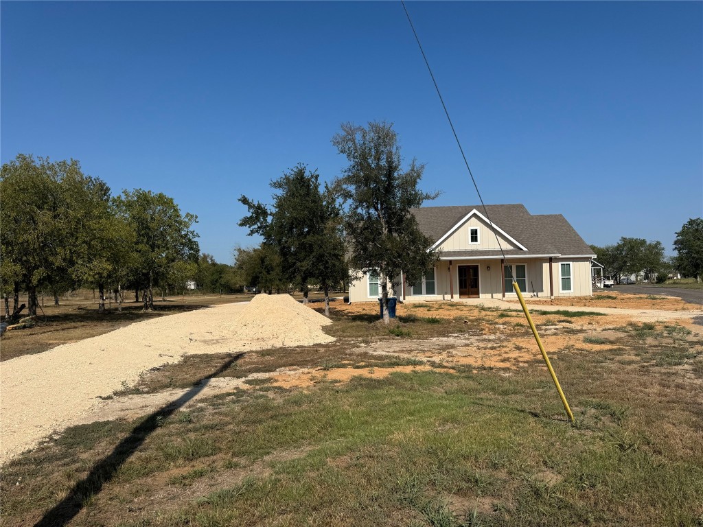 1353 Red Town Road, Unit B Elgin, TX 78621 - Photo 2 of 22 a front view of a house with a yard