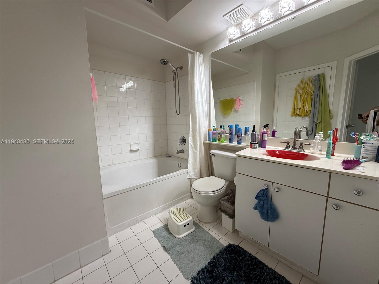 17145 North Bay Road, Unit 4506 Sunny Isles Beach, FL 33160 - Photo 5 of 10 a bathroom with a sink toilet and shower