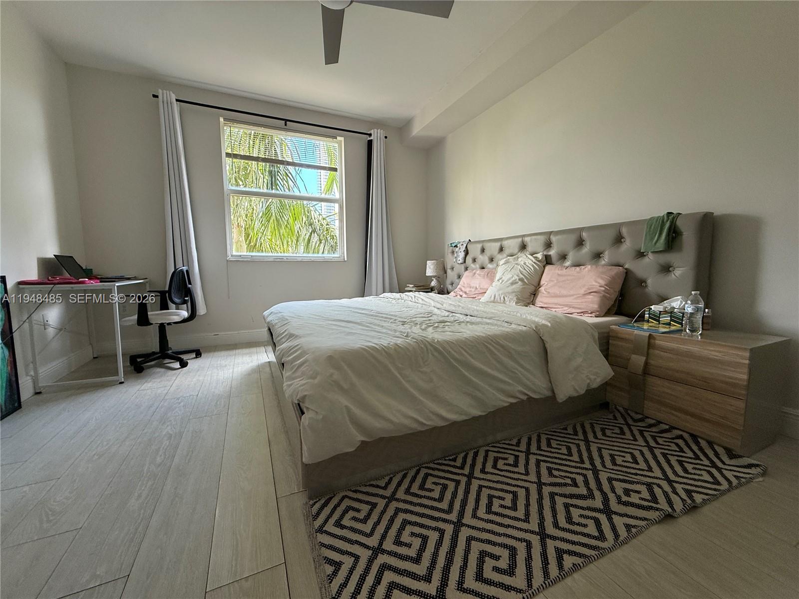 17145 North Bay Road, Unit 4506 Sunny Isles Beach, FL 33160 - Photo 7 of 10 a bedroom with a bed and a window