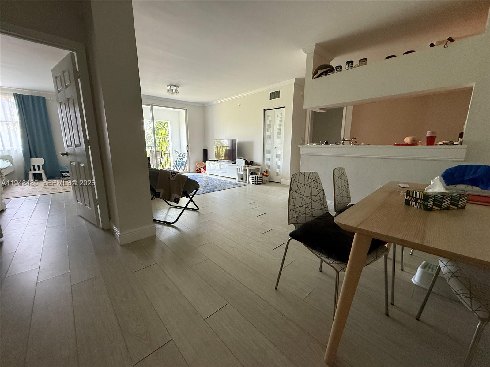 17145 North Bay Road, Unit 4506 Sunny Isles Beach, FL 33160 - Photo 9 of 10 a living room with furniture and wooden floor