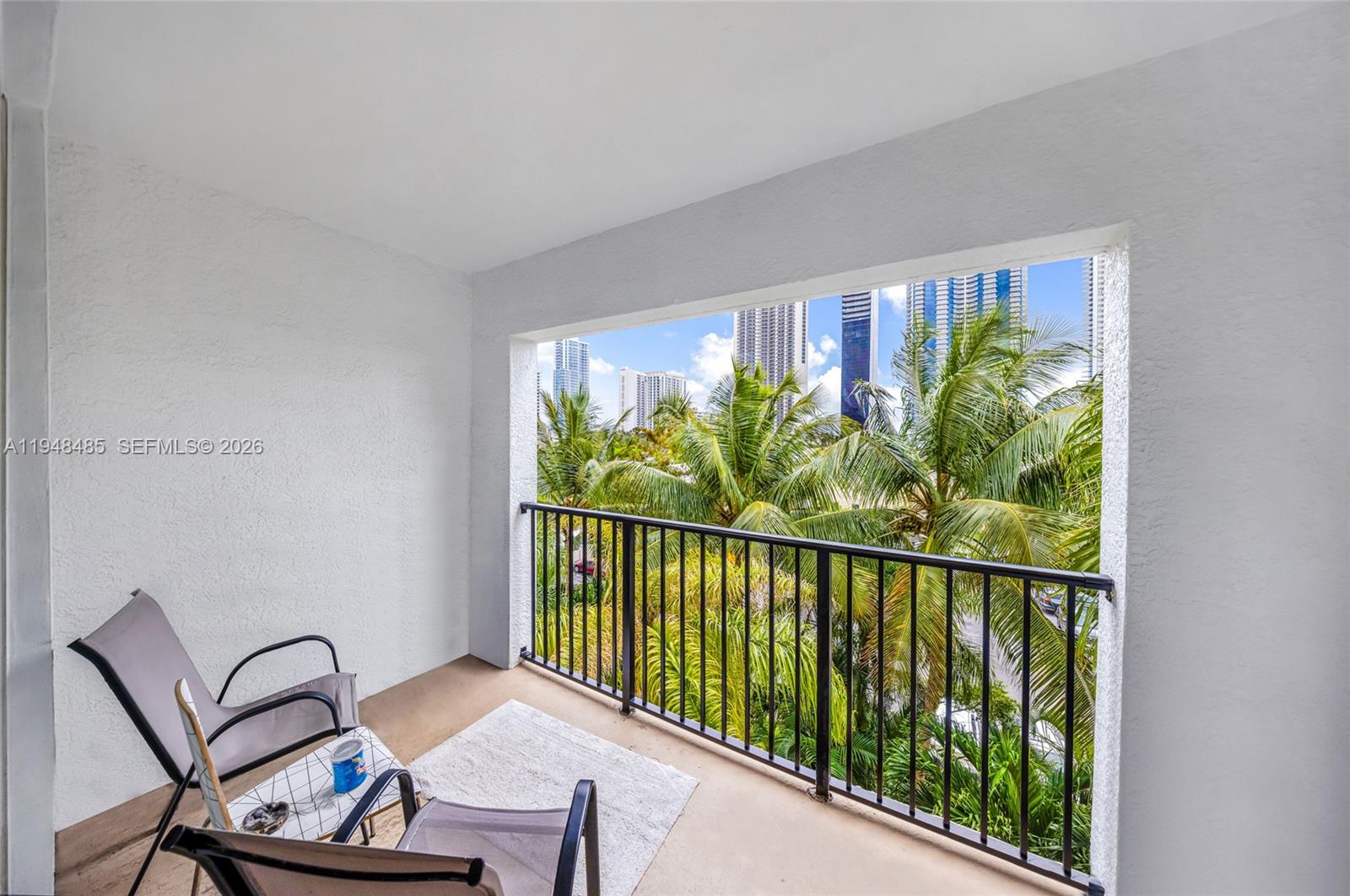 17145 North Bay Road, Unit 4506 Sunny Isles Beach, FL 33160 - Photo 9 of 10 a view of a balcony with furniture
