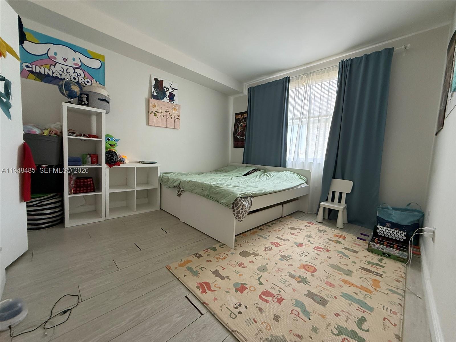 17145 North Bay Road, Unit 4506 Sunny Isles Beach, FL 33160 - Photo 10 of 10 a spacious bedroom with a bed and a large window