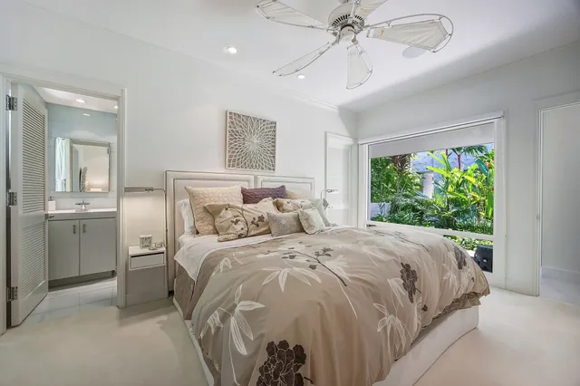 a bathroom with a double vanity sink mirror and toilet