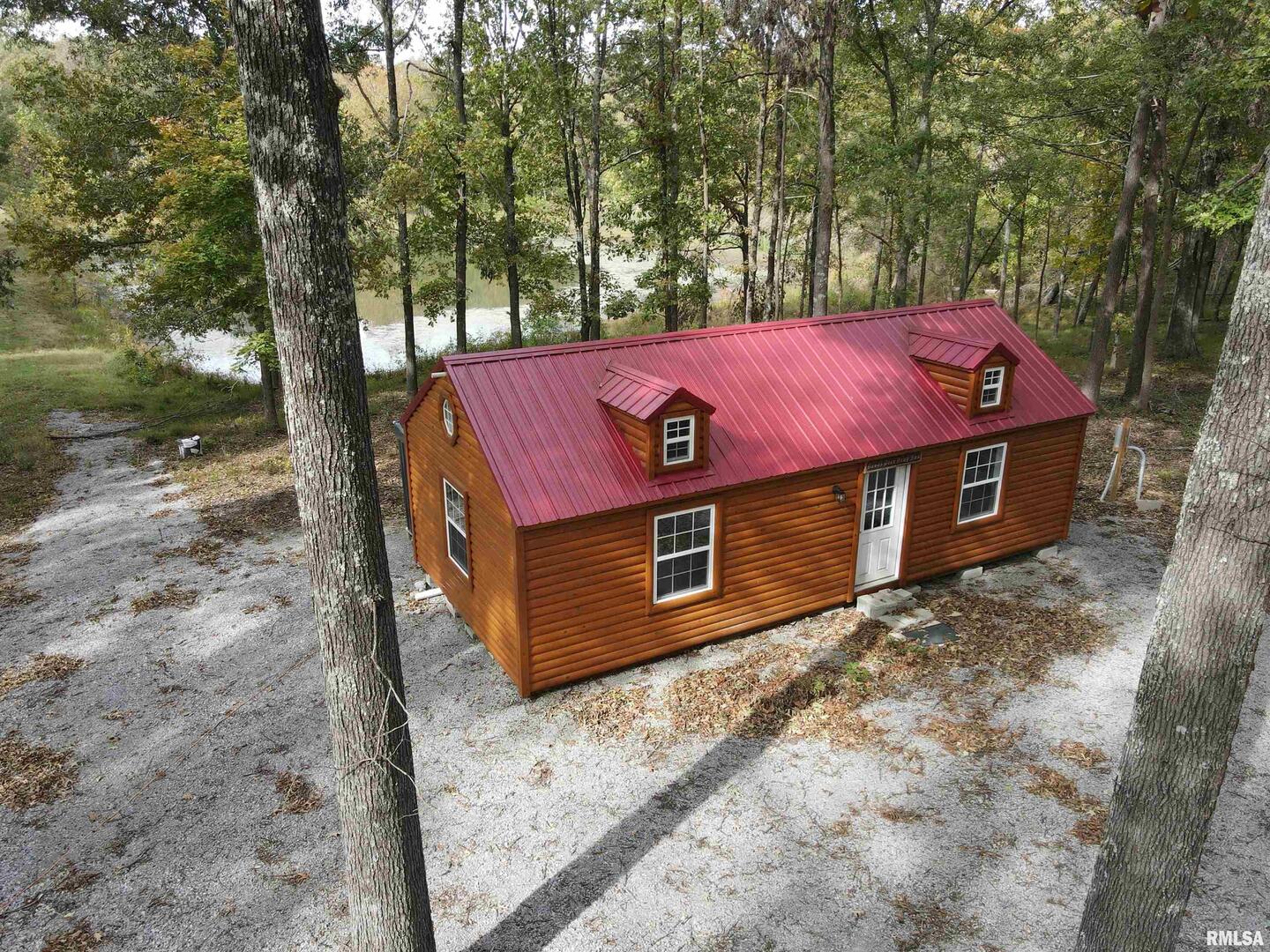 0 North Shawnee Hills Road Equality, IL 62934 - Photo 1 of 22 a view of a wooden house with a large tree