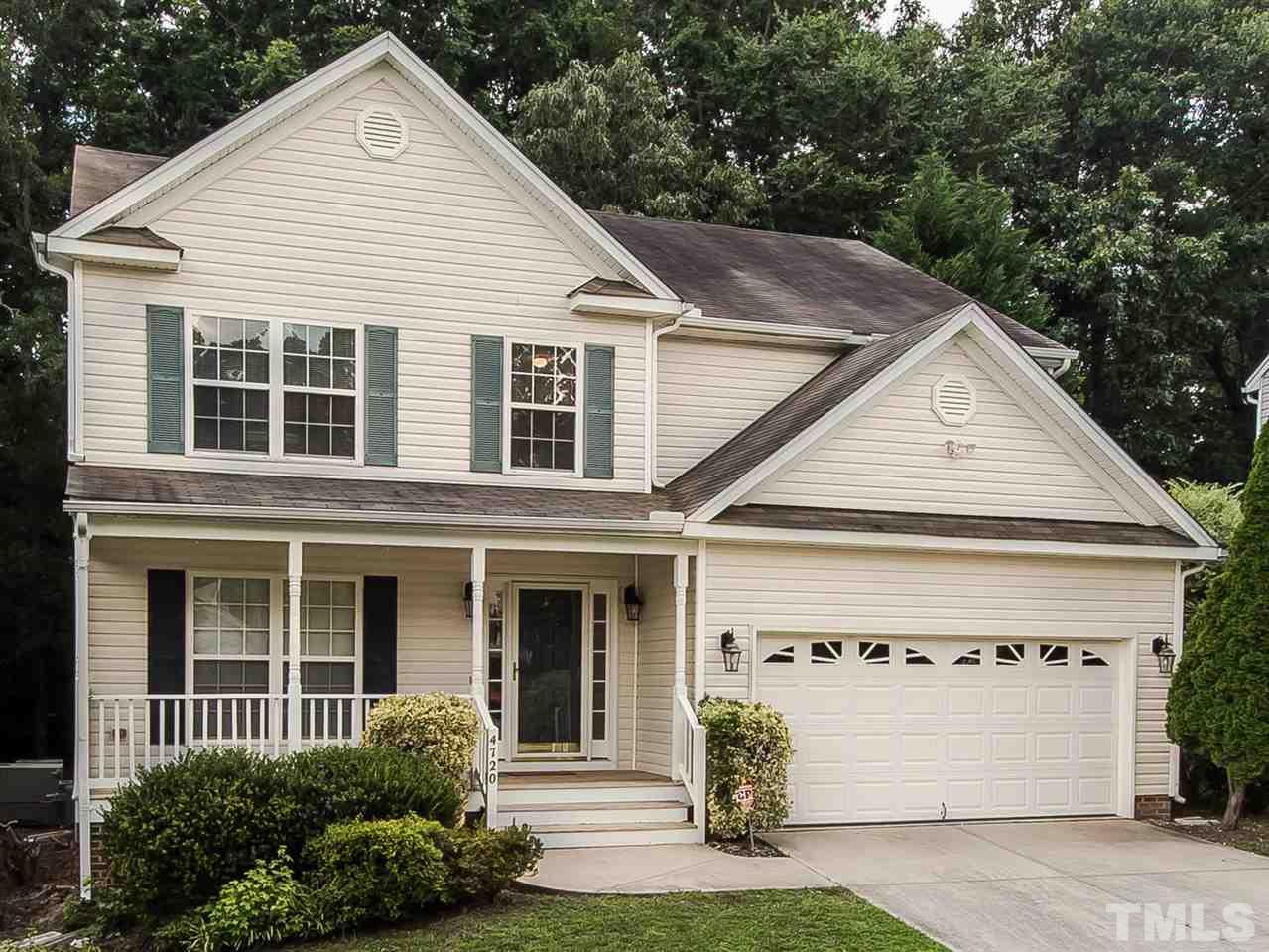 4720 Drewbridge Way Raleigh, NC 27604 - Photo 1 of 21 a view of a white house with large windows and a small yard
