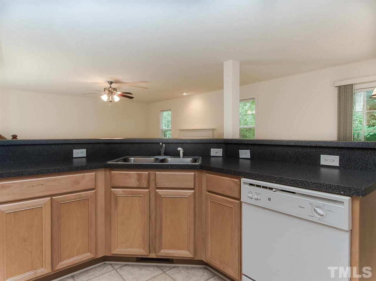 4720 Drewbridge Way Raleigh, NC 27604 - Photo 12 of 21 a kitchen with white cabinets and sink
