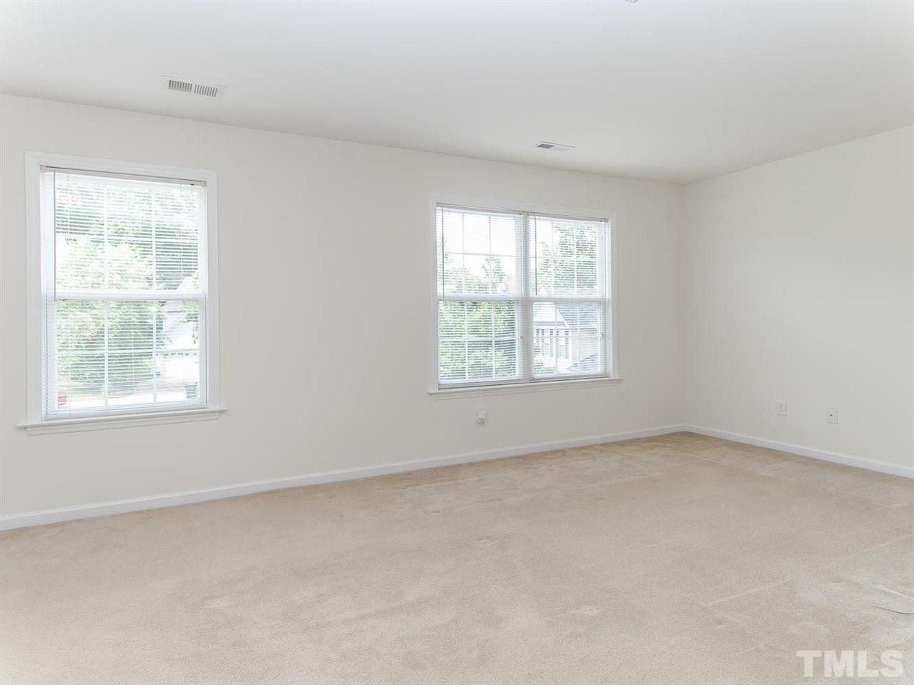 4720 Drewbridge Way Raleigh, NC 27604 - Photo 14 of 21 an empty room with a window