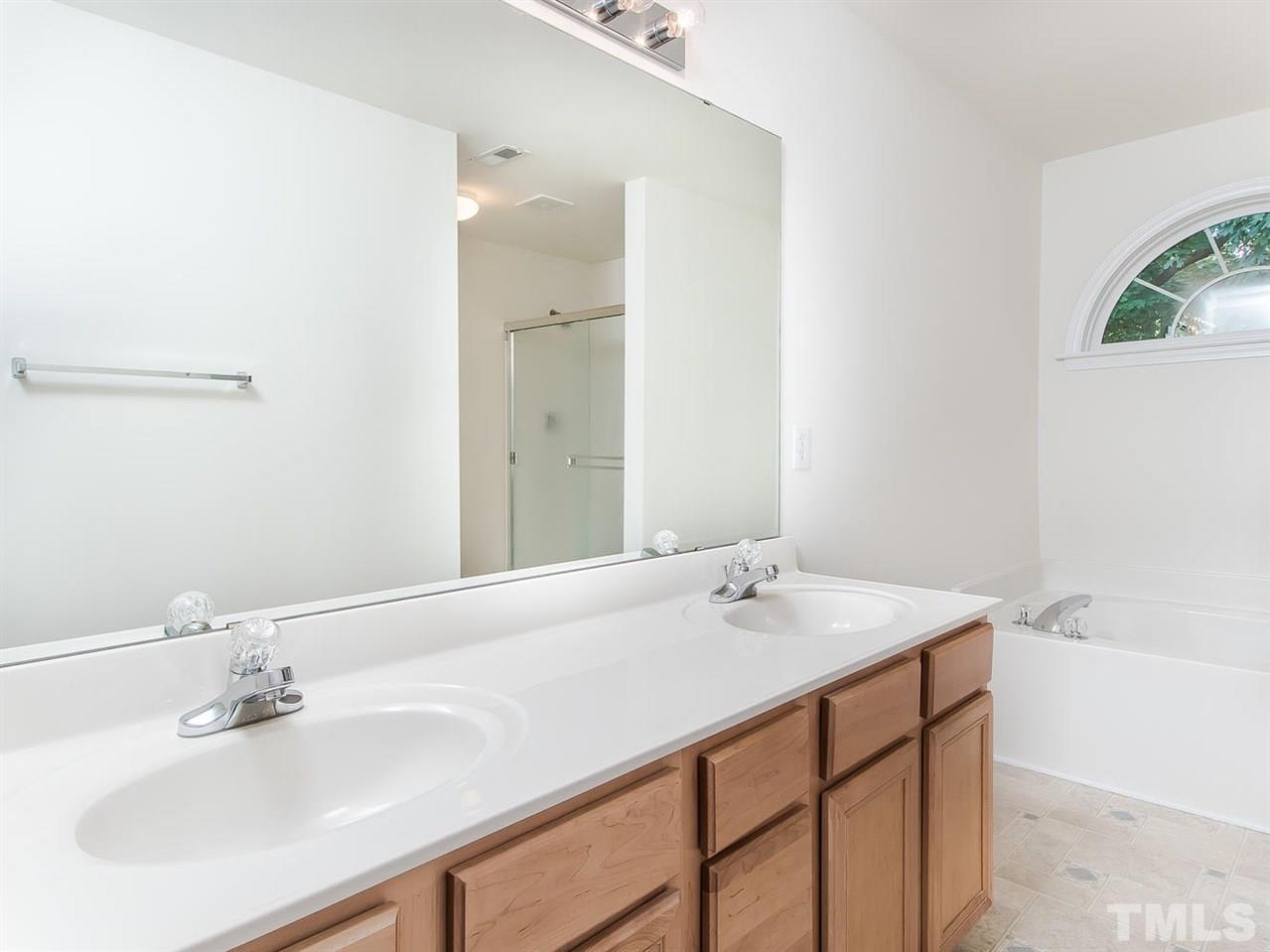 4720 Drewbridge Way Raleigh, NC 27604 - Photo 18 of 21 a bathroom with a sink and a bathtub