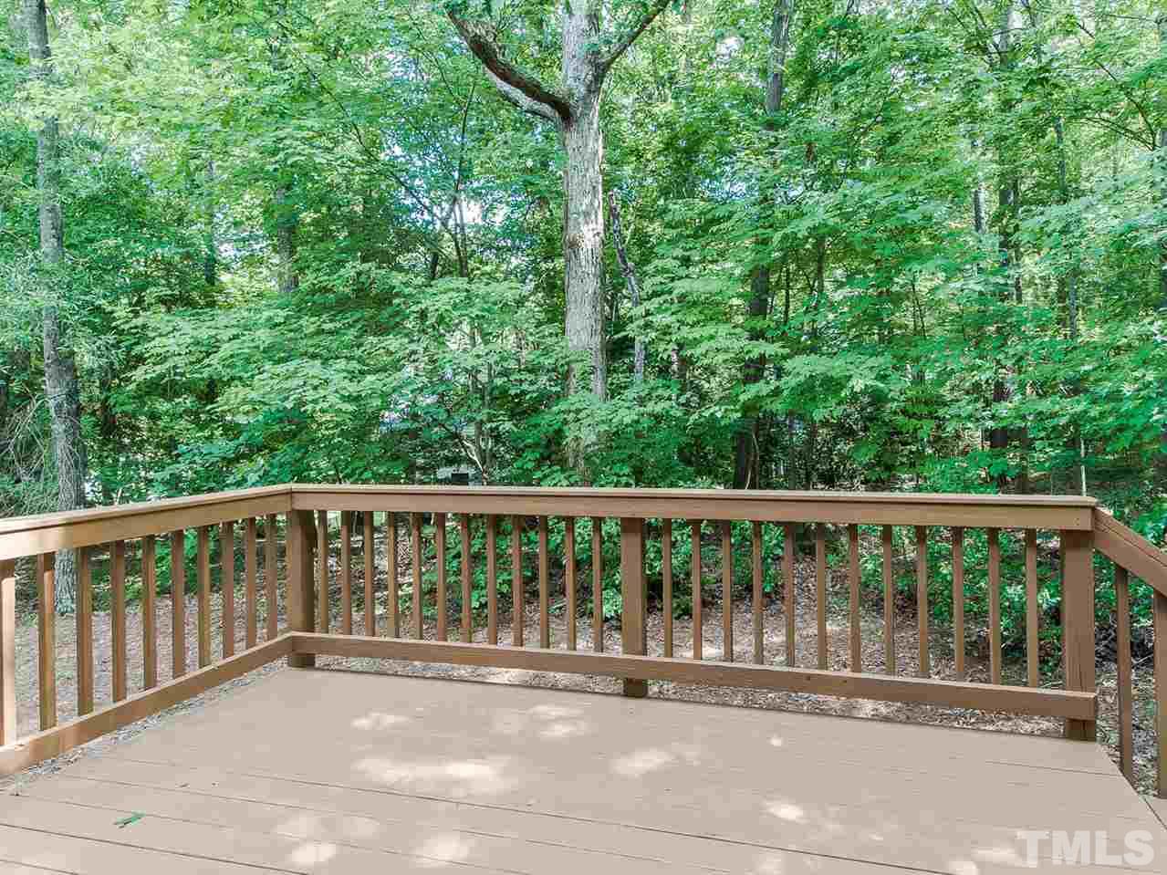 4720 Drewbridge Way Raleigh, NC 27604 - Photo 20 of 21 a balcony with wooden floor and yard in the back