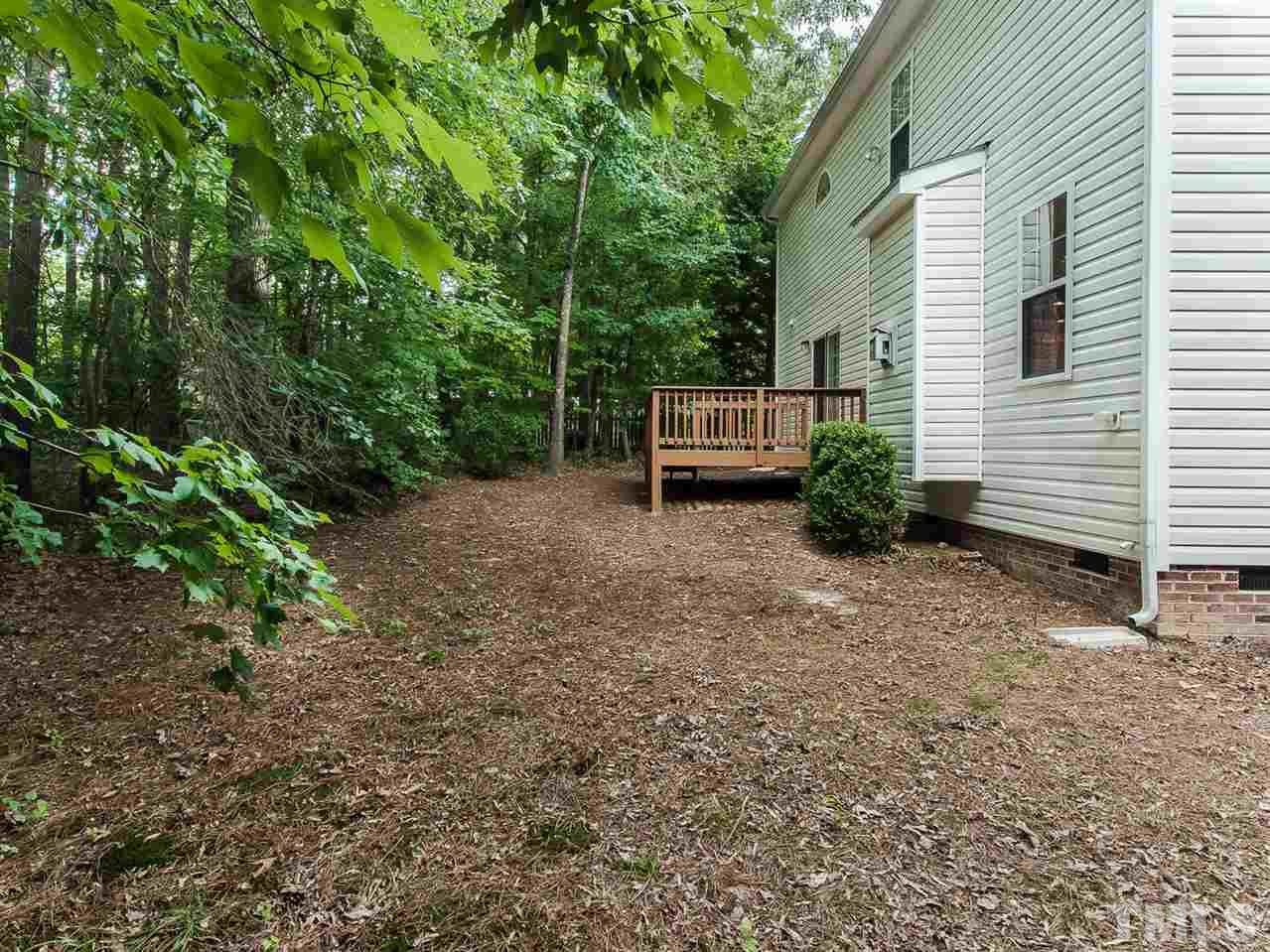 4720 Drewbridge Way Raleigh, NC 27604 - Photo 21 of 21 a view of a house with a backyard and furniture