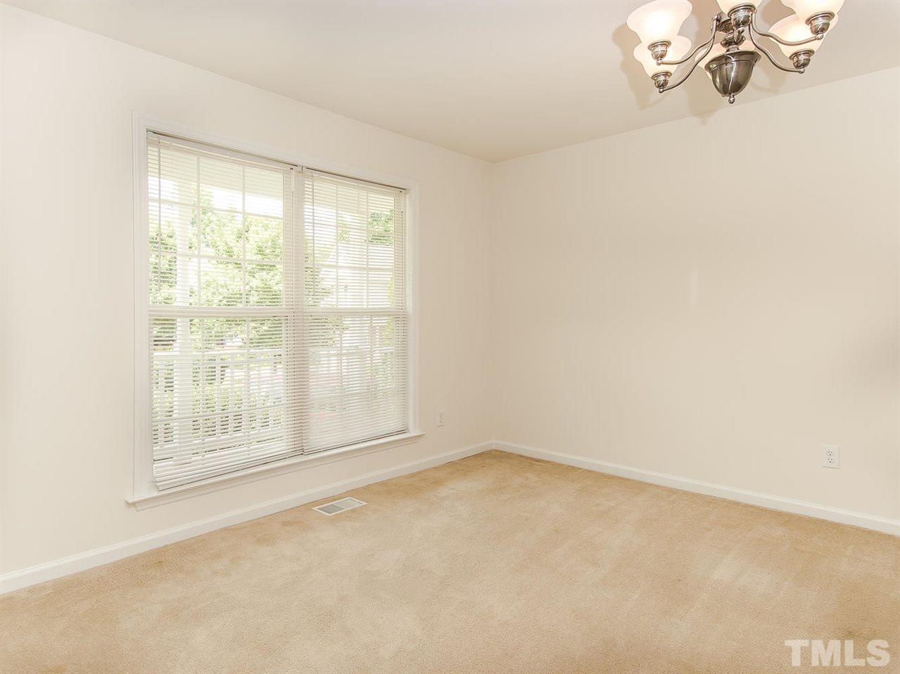 4720 Drewbridge Way Raleigh, NC 27604 - Photo 6 of 21 an empty room with a empty space and a window