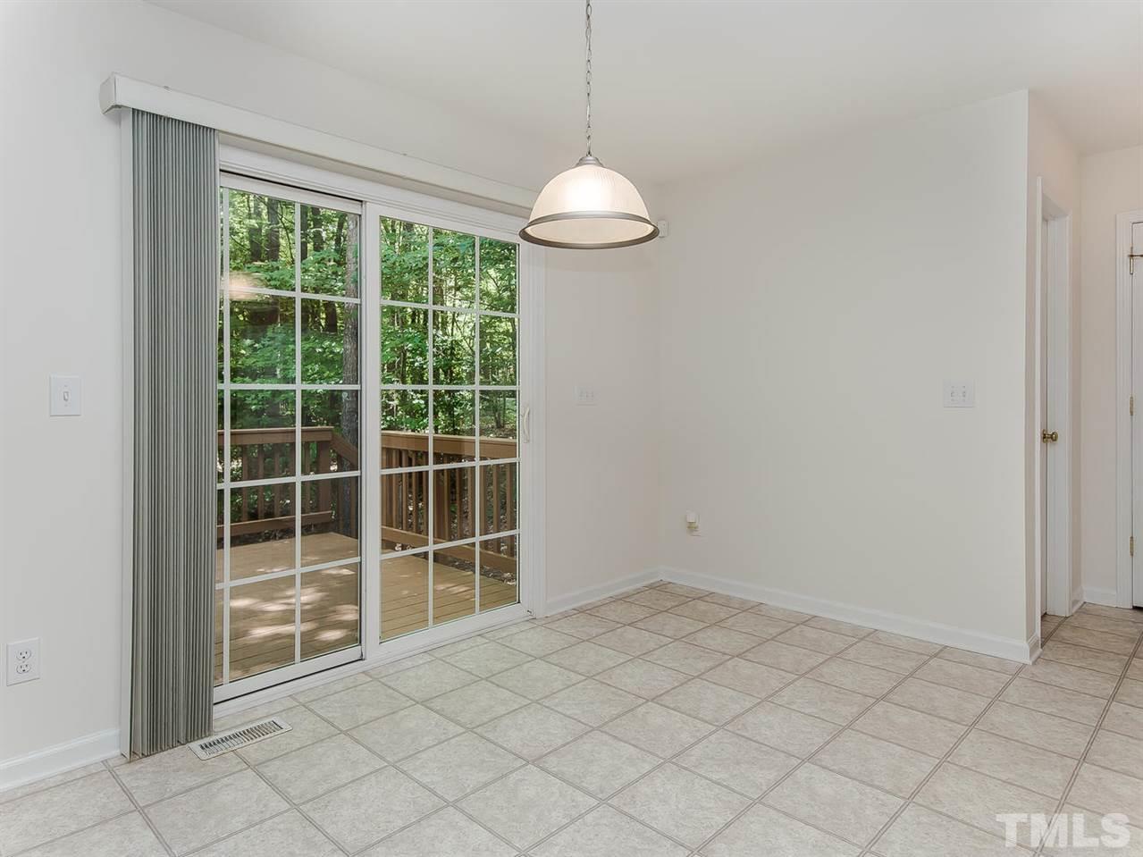 4720 Drewbridge Way Raleigh, NC 27604 - Photo 9 of 21 a view of an empty room with a window