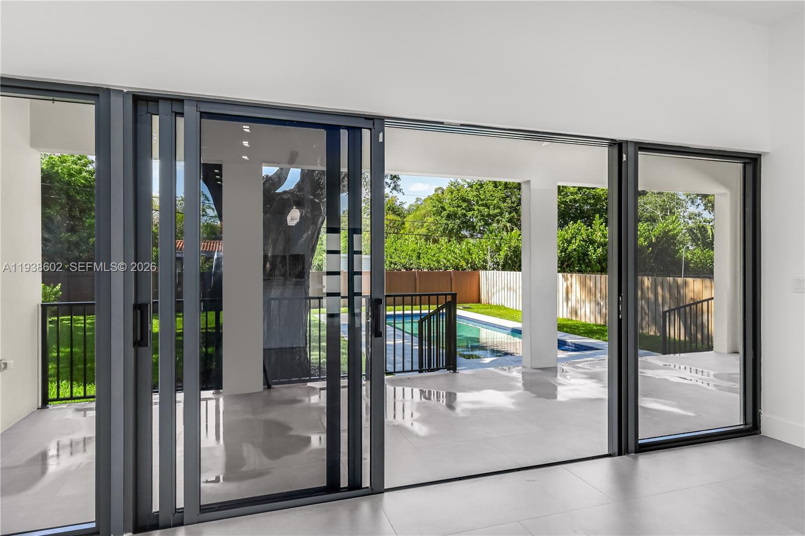 1030 Northeast 121st Street Biscayne Park, FL 33161 - Photo 10 of 47 a view of a glass door and an entryway