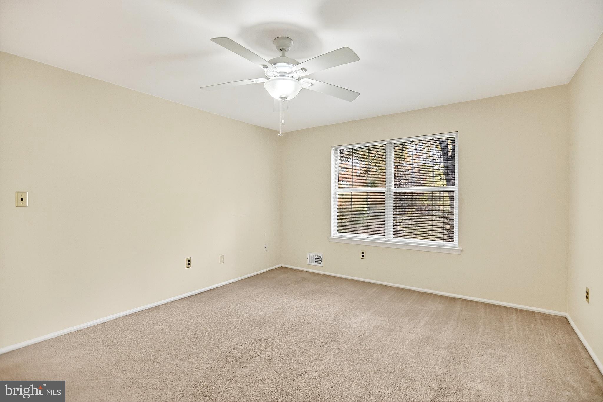 13 Azalea Court Lawrenceville, NJ 08648 - Photo 21 of 27 an empty room with windows and fan