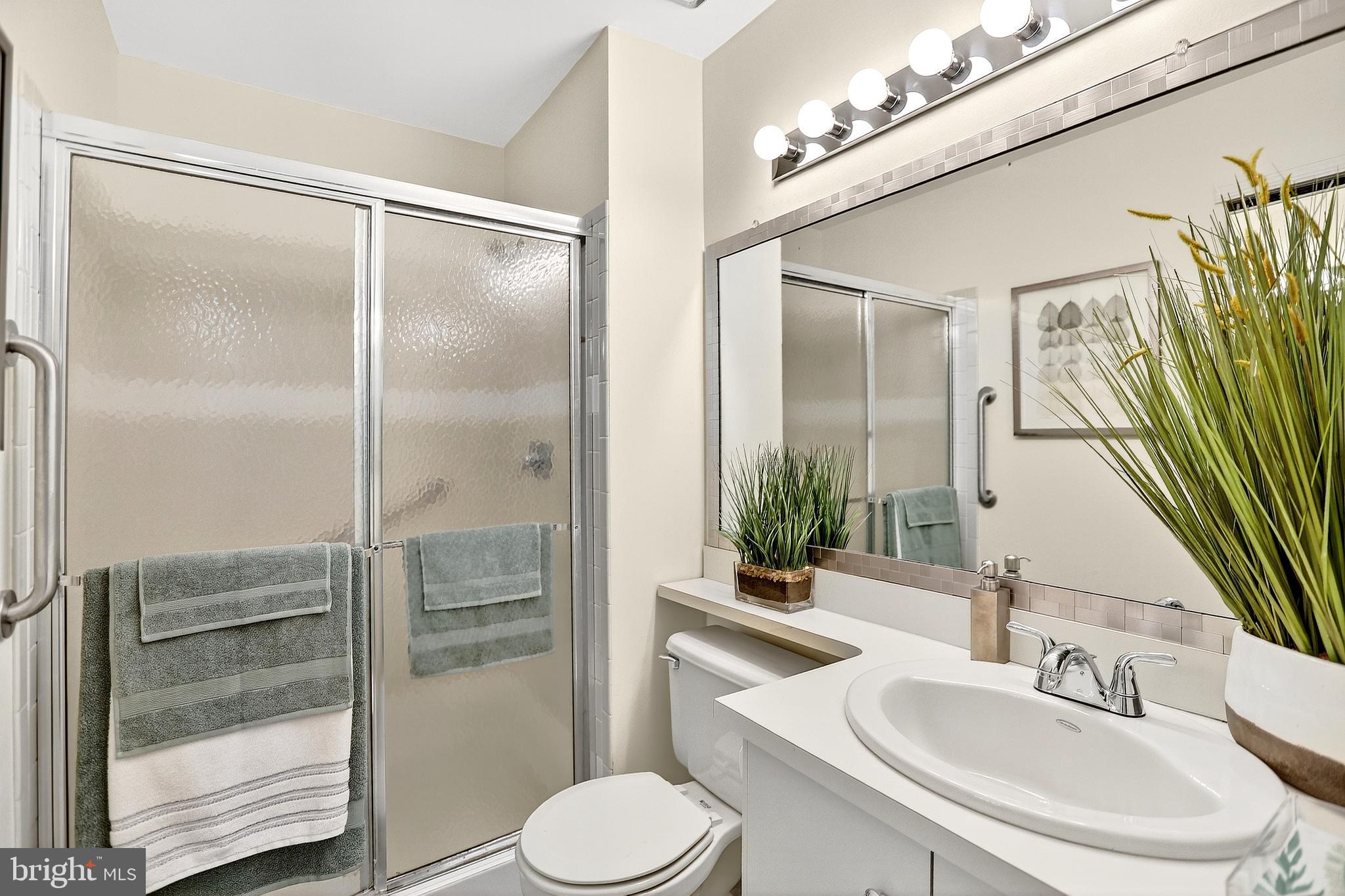 13 Azalea Court Lawrenceville, NJ 08648 - Photo 25 of 27 a bathroom with a sink and a mirror