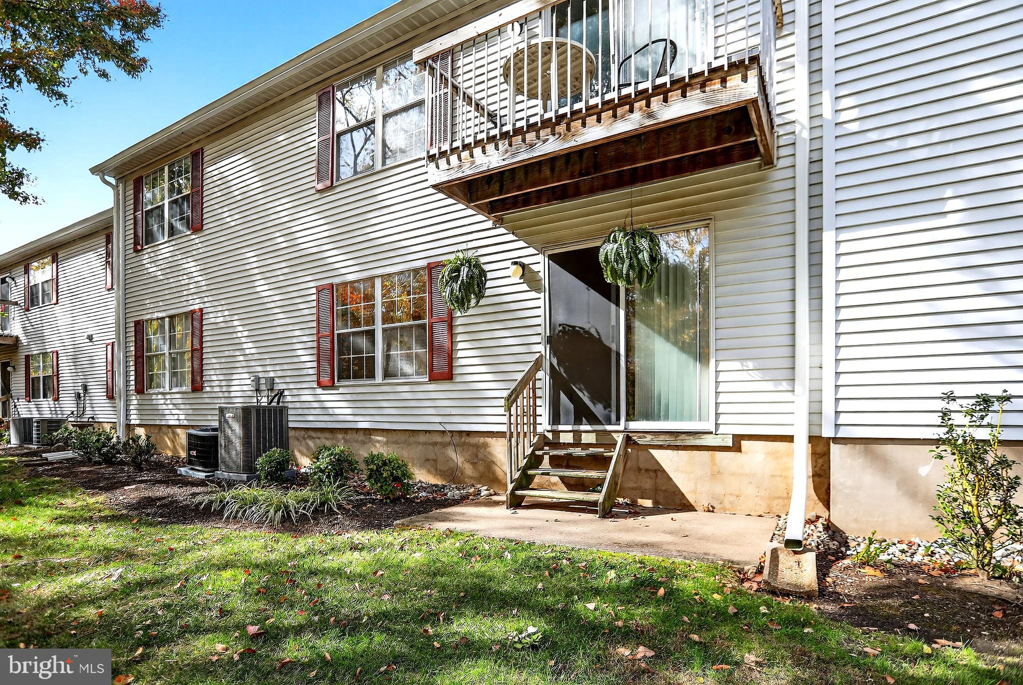 13 Azalea Court Lawrenceville, NJ 08648 - Photo 26 of 27 a view of a house with backyard and sitting area
