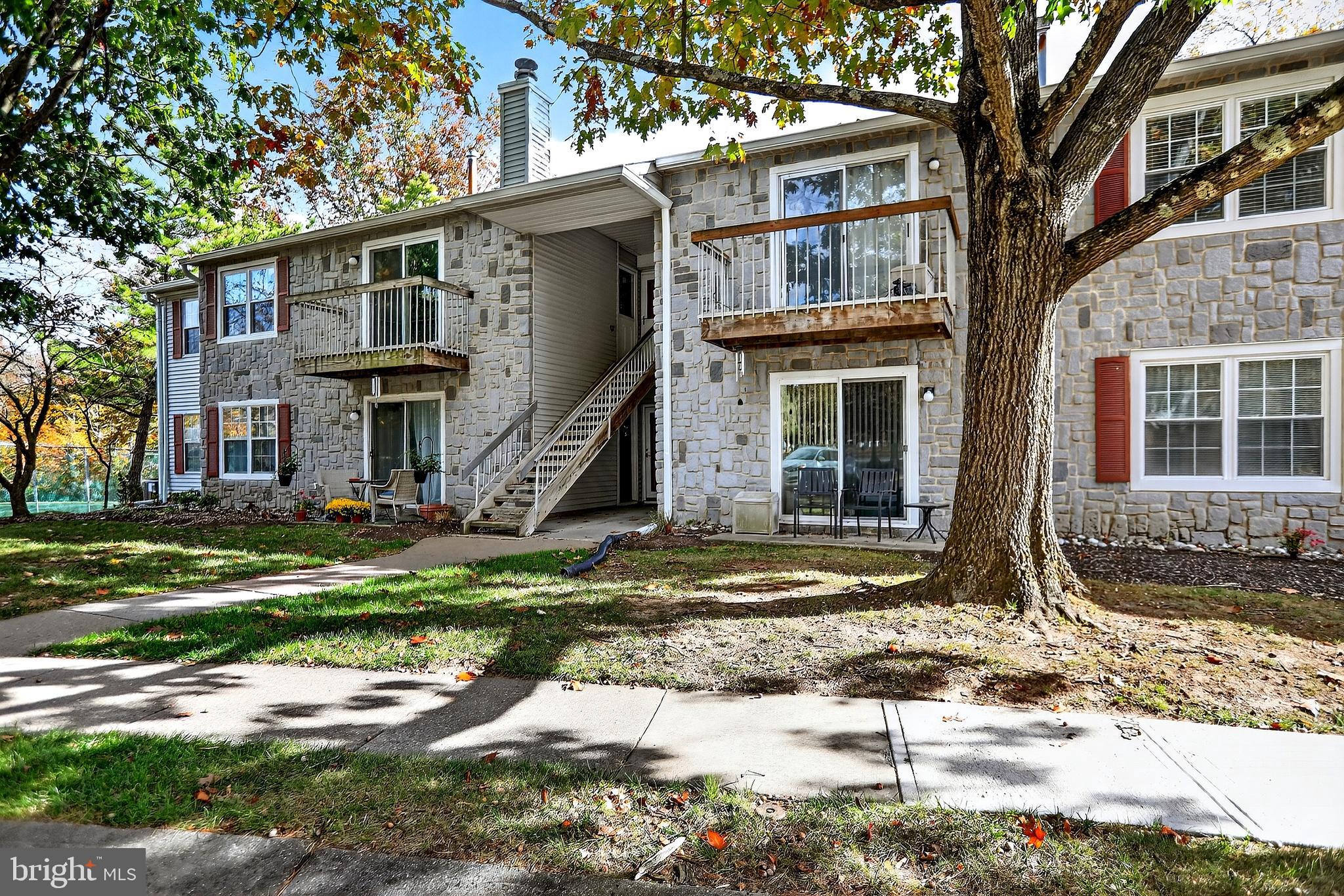 13 Azalea Court Lawrenceville, NJ 08648 - Photo 4 of 27 a front view of a house with a yard