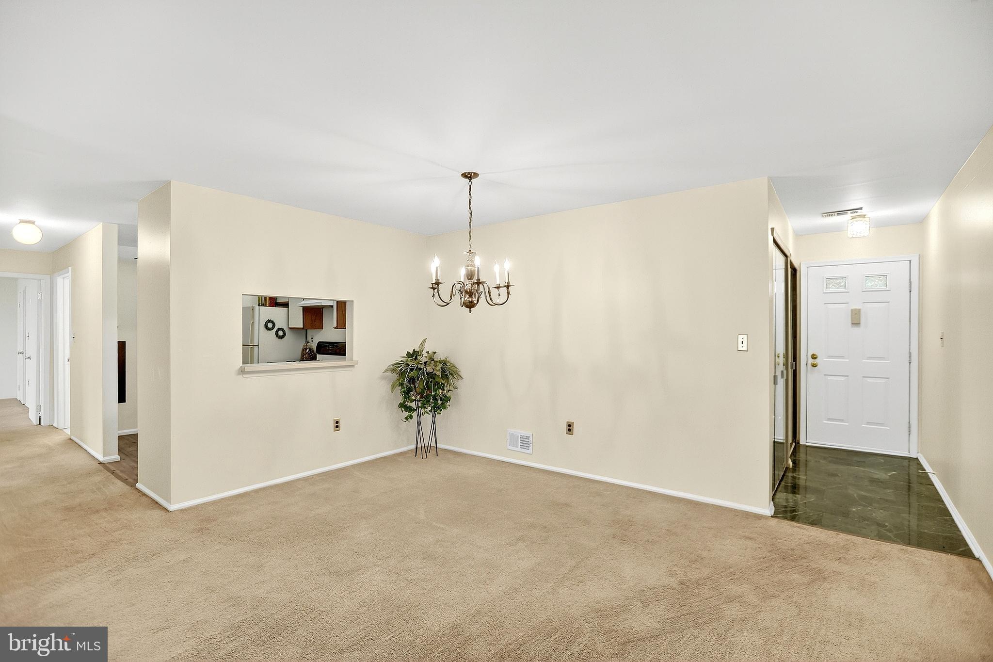 13 Azalea Court Lawrenceville, NJ 08648 - Photo 9 of 27 a view of a hallway with entryway and chandelier