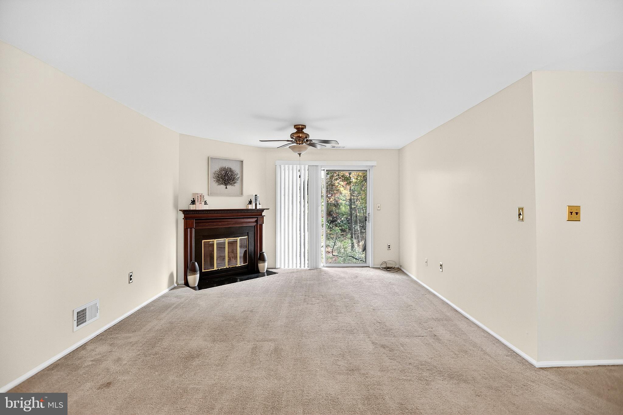 13 Azalea Court Lawrenceville, NJ 08648 - Photo 10 of 27 a view of a livingroom with a fireplace and a window