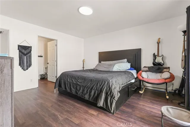 a bedroom with a large bed and a large window