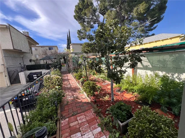 a view of path along with retail shop and buildings