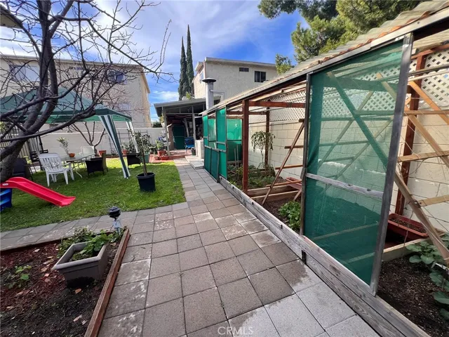 a view of building with yard and seating area