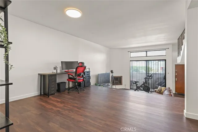 a view of a livingroom with furniture and a flat screen tv
