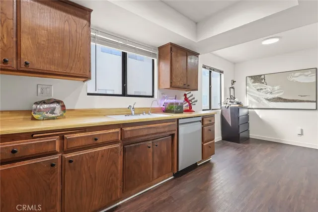 a view of a workspace with furniture and a gym cycle