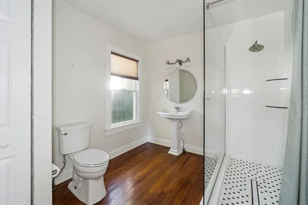 a bathroom with a toilet and a sink