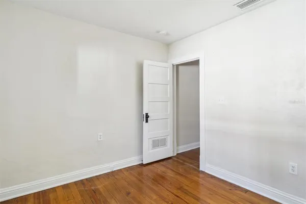 a bathroom with a bathtub shower sink vanity and toilet