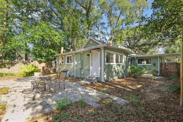 a view of wooden door with outdoor seating