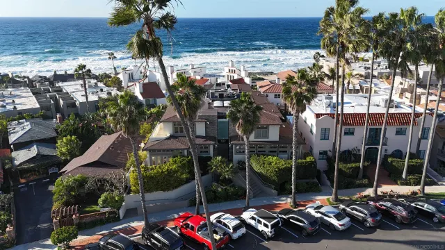 a view of a patio with table and chairs and potted plants