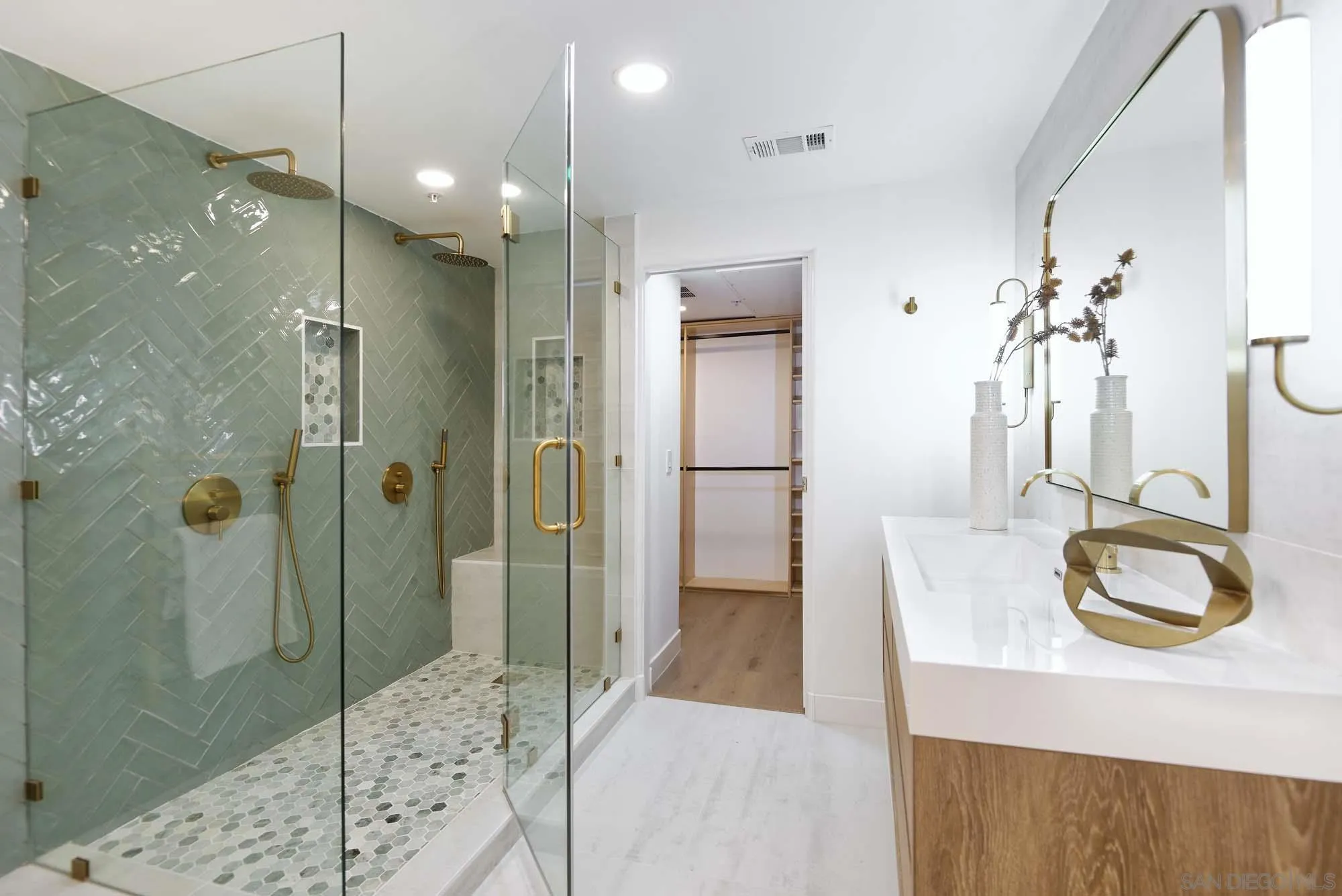 302 Prospect Street, Unit 6 La Jolla, CA 92037 - Photo 16 of 28 a bathroom with a granite countertop sink a shower and a mirror