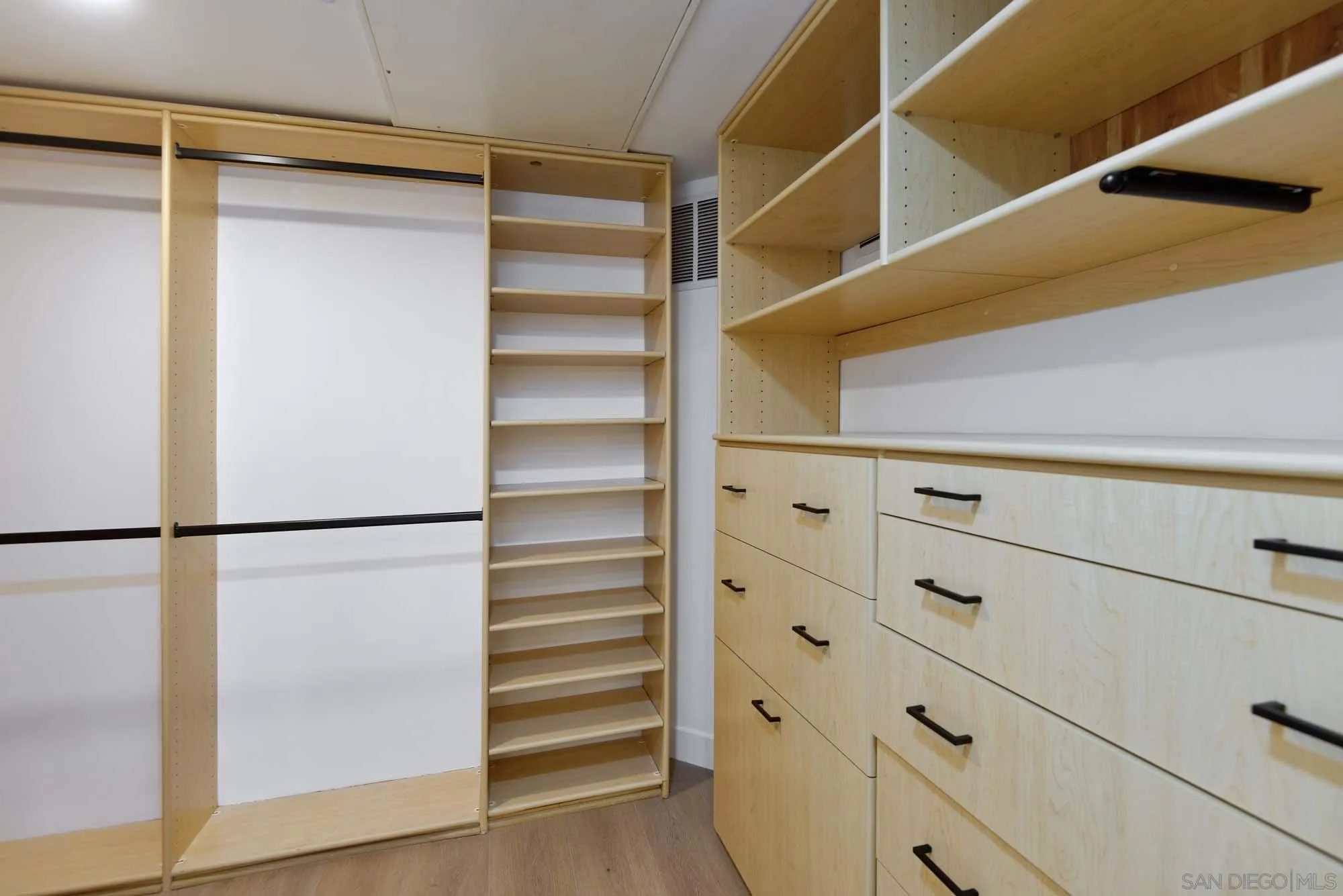 302 Prospect Street, Unit 6 La Jolla, CA 92037 - Photo 17 of 28 a view of walk in closet with empty racks