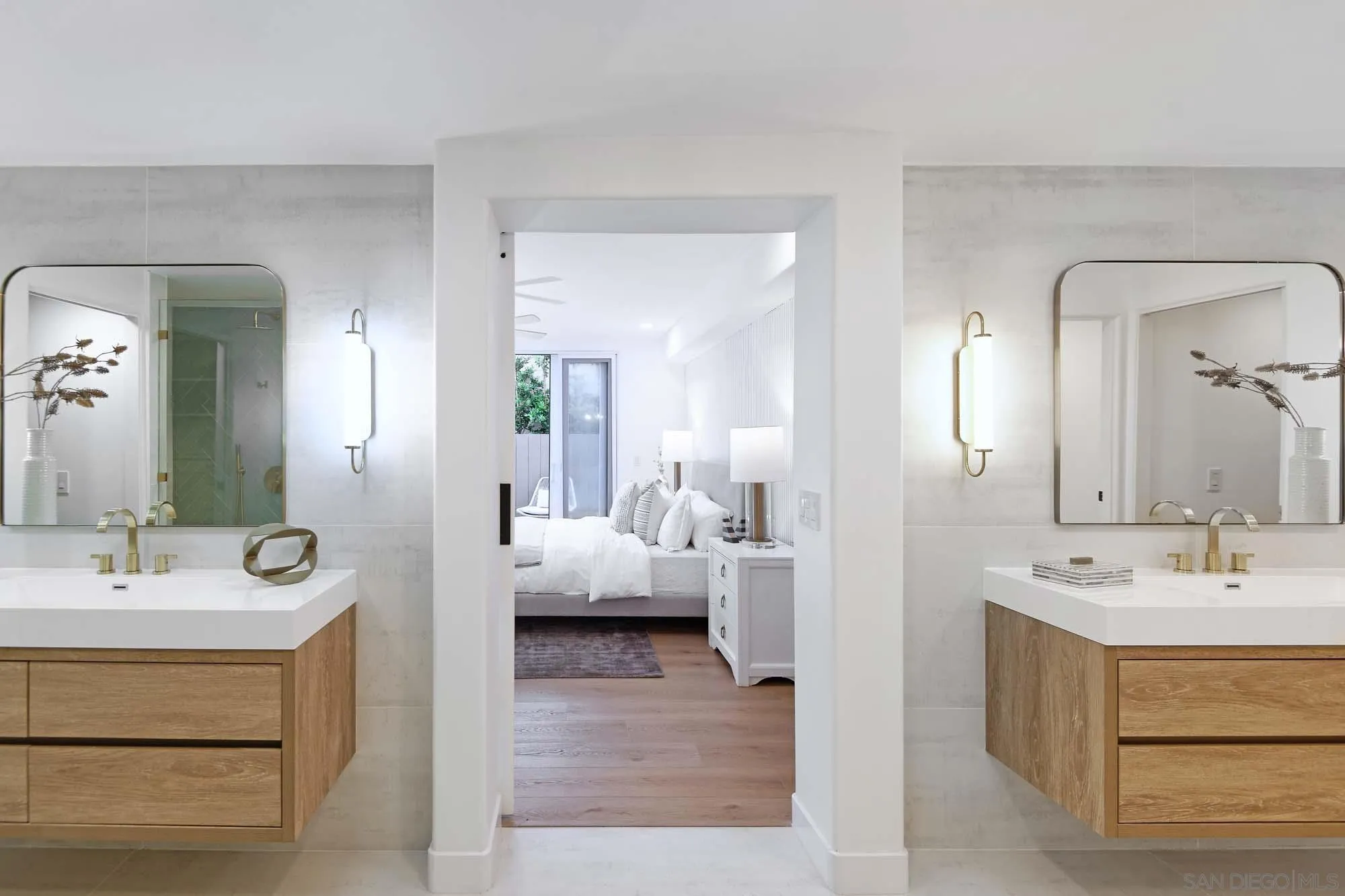 302 Prospect Street, Unit 6 La Jolla, CA 92037 - Photo 18 of 28 a en suite bathroom with a double vanity sink and mirror