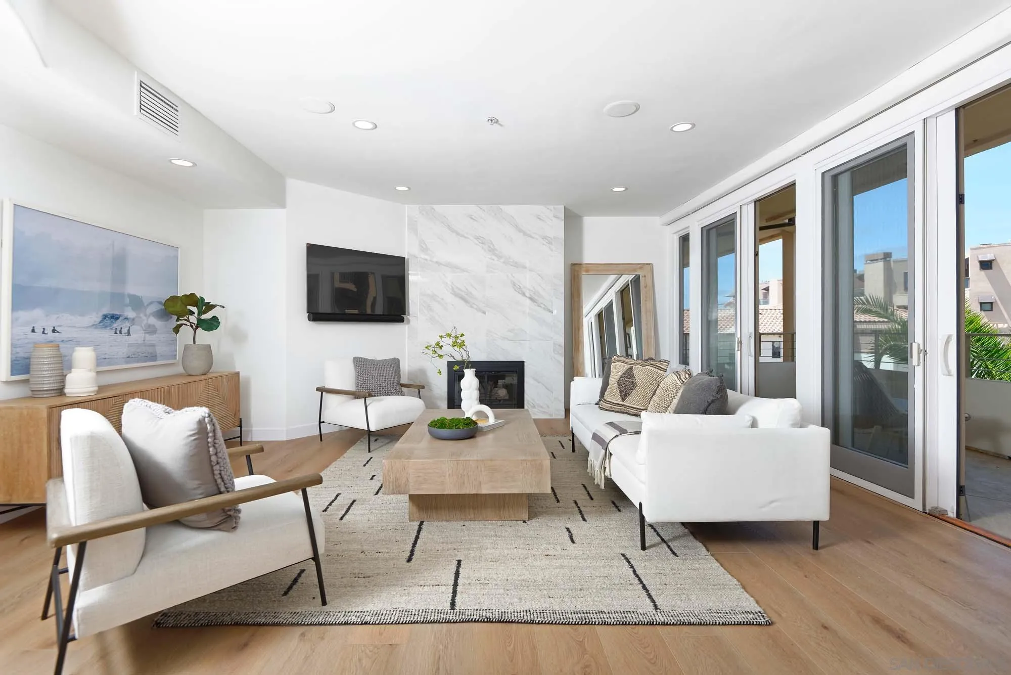 302 Prospect Street, Unit 6 La Jolla, CA 92037 - Photo 4 of 28 a living room with furniture and a flat screen tv