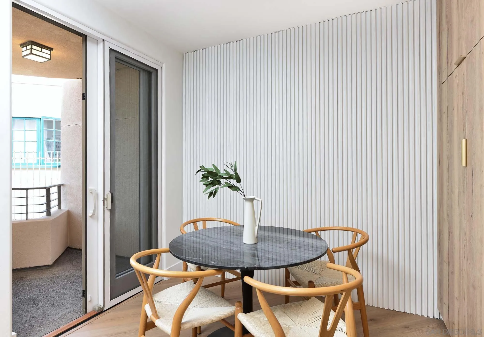 302 Prospect Street, Unit 6 La Jolla, CA 92037 - Photo 9 of 28 a view of a room with furniture and wooden floor