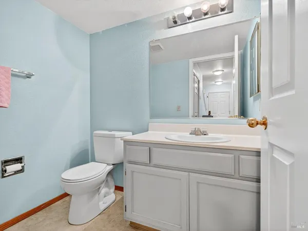 a bathroom with a tub shower and sink