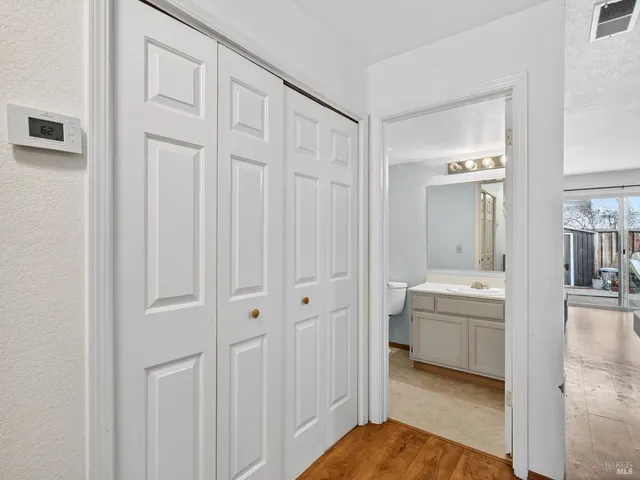 a bedroom with a bed dresser and a window