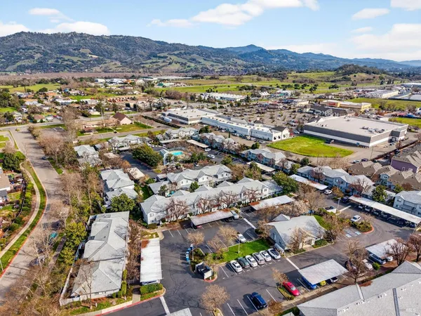an aerial view of residential houses with outdoor space