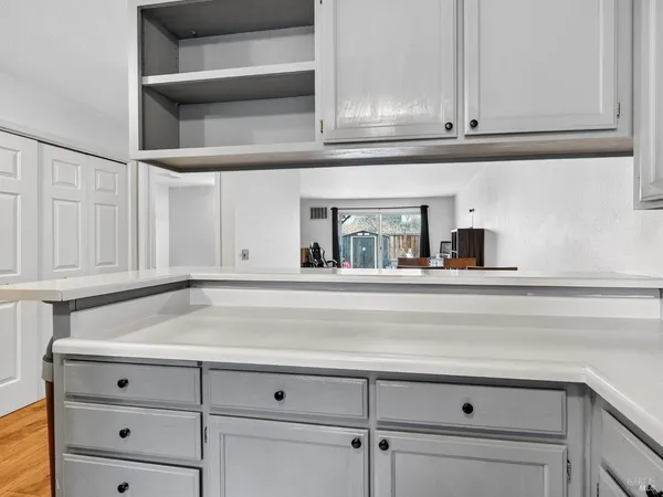 a kitchen with stainless steel appliances a sink stove and microwave