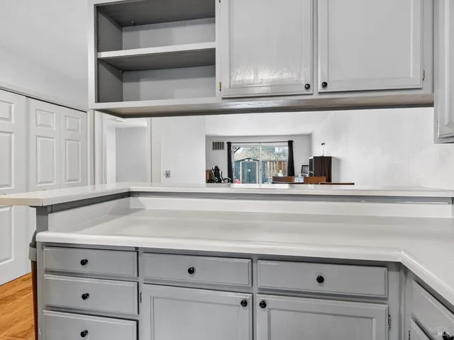 a kitchen with stainless steel appliances a sink stove and microwave
