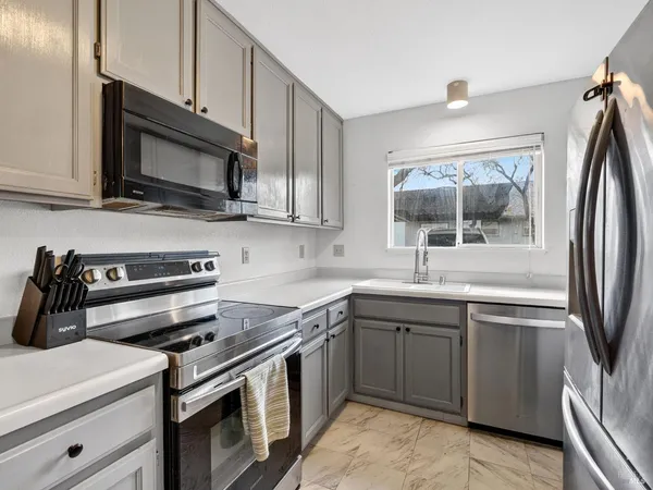 a kitchen with a sink and a window